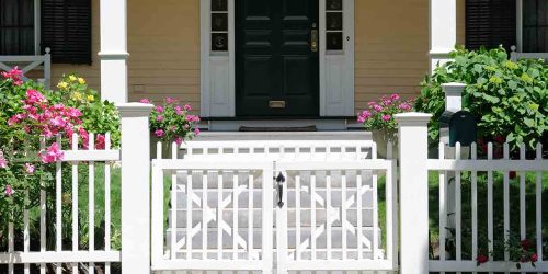 home-with-white-picket-fence-and-gate
