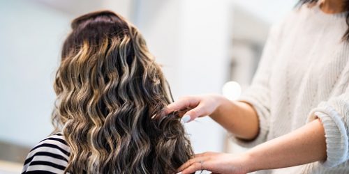 Hair stylist dooing a hair care treatment for client