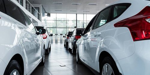 Stock of cars in showroom of automobile dealer